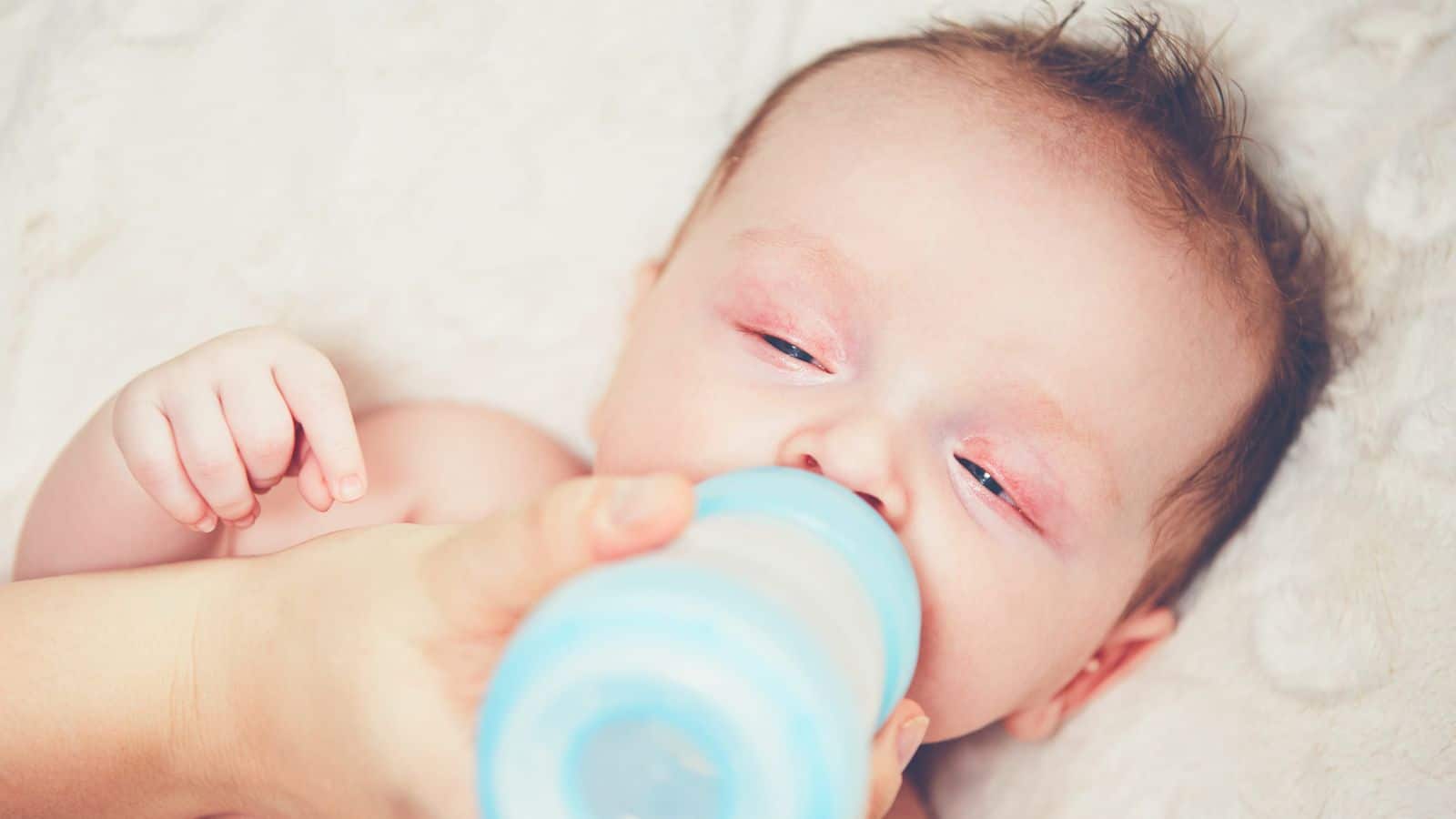 Hungry baby drinking milk