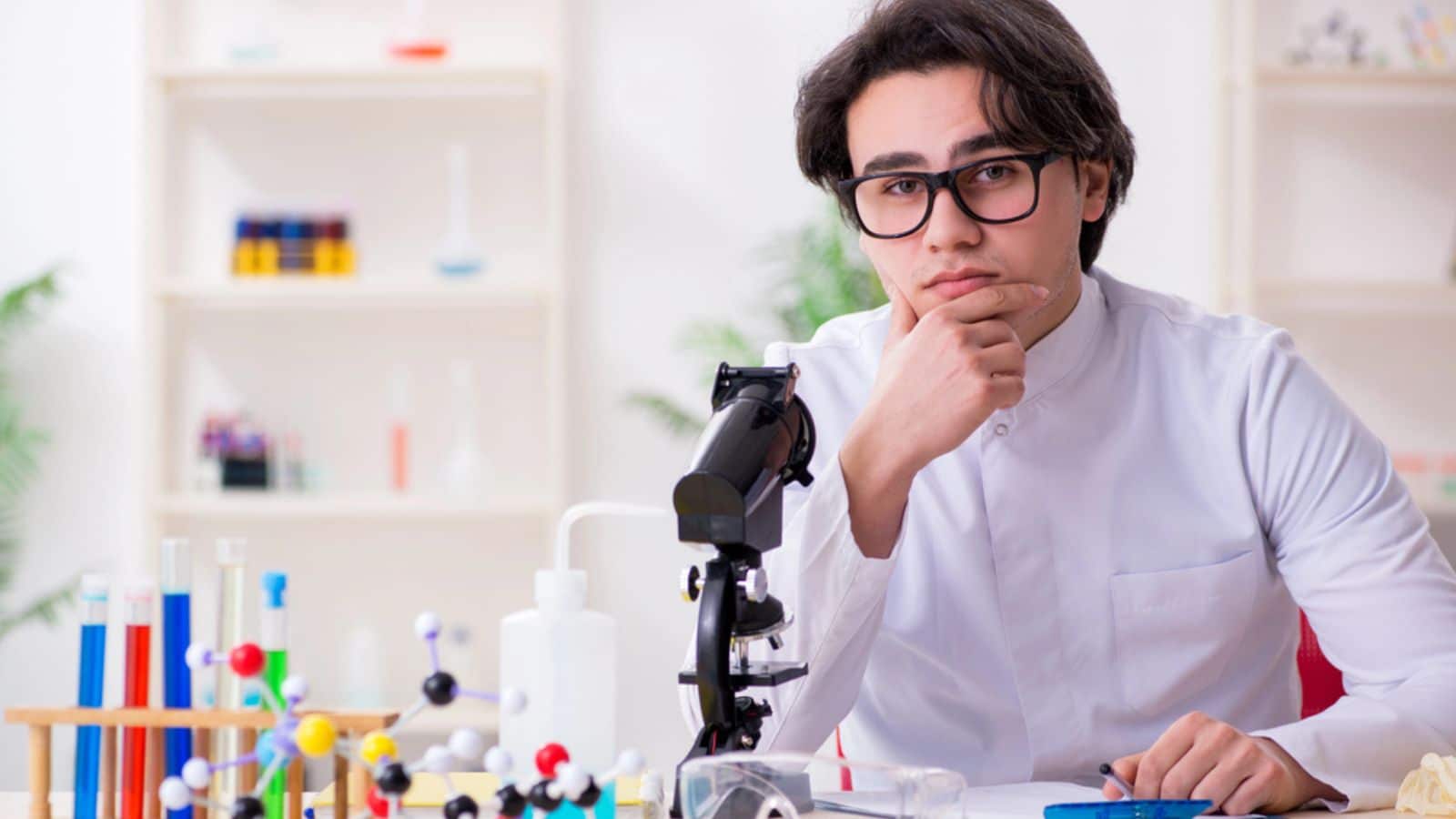 Young male biochemist working in the lab