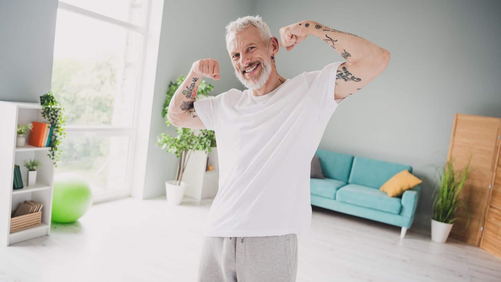 senior man flexing muscles